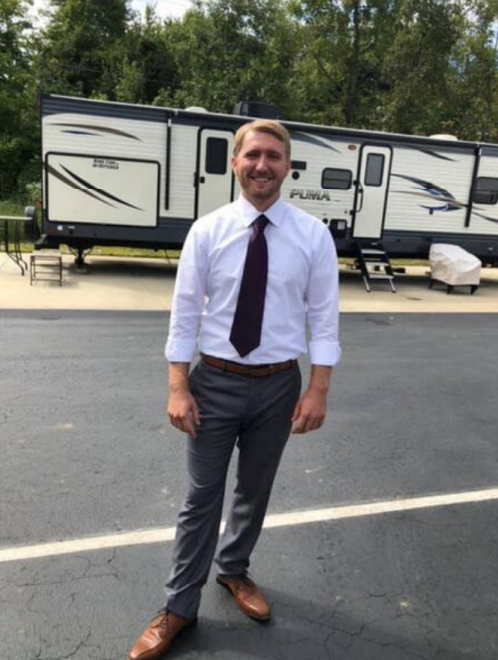 Josh Hillier, owner of J&L Cleaner Homes, standing beside professional pressure washing equipment in Stow, OH
